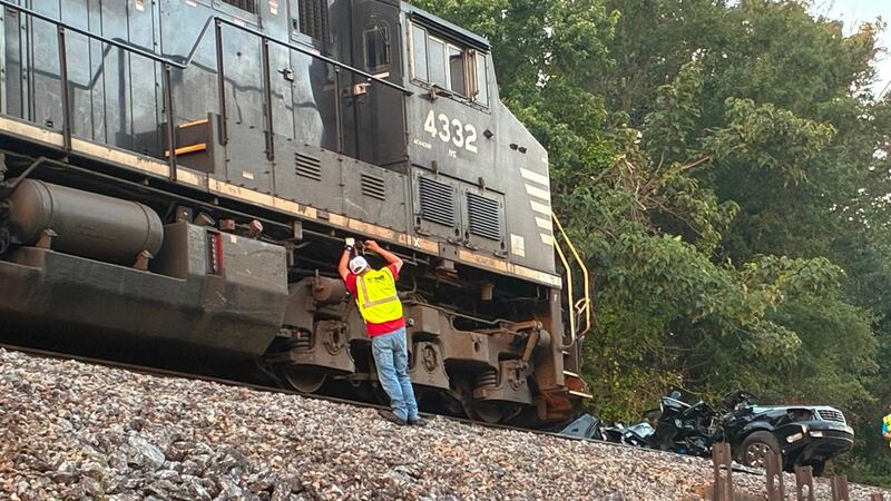 A train destroyed an SUV Friday after slamming into it at a North Carolina crossing, officials...
