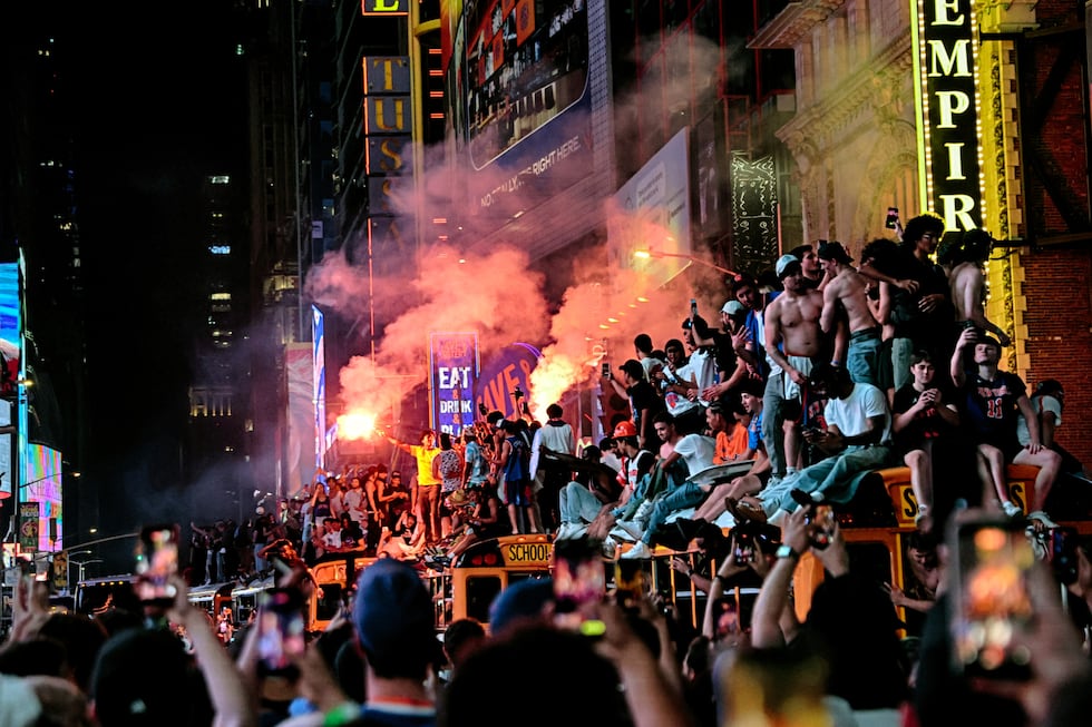 New York Knicks fans celebrate their victory after Game 5 of the NBA Finals basketball series...