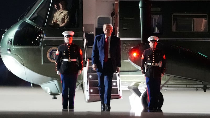 FILE -- President Donald Trump arrives on Marine One to board Air Force One at...